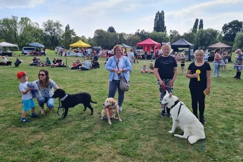 The park was full of people enjoying the dog show as well as the stalls set up by local businesses.
