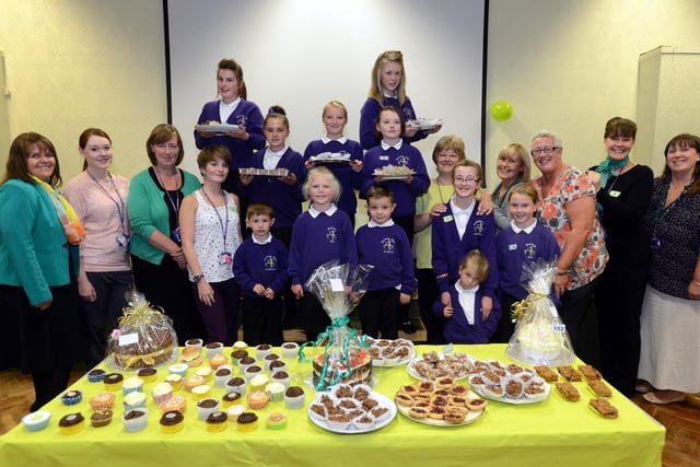 Some of the staff and pupils at Hastings Hill Academy who raised over £600 during the Macmilan Worlds Biggest Coffee Morning event in 2013. Have you spotted someone you know?