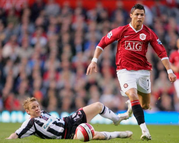 Cristiano Ronaldo of Manchester United races away from Derek Geary of Sheffield United (John Peters/Manchester United via Getty Images)