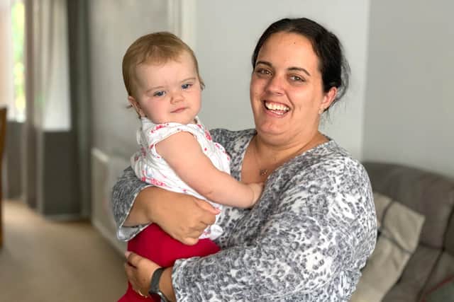 Amy Mitchell with her daughter, Darcy, who turns one next month