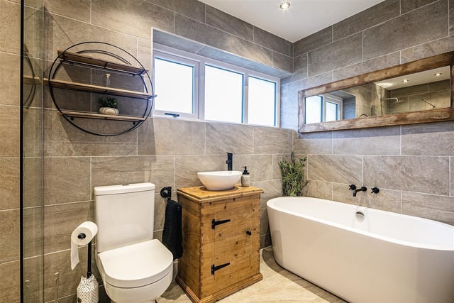 The bathroom comes as a four-piece suite, with a shower, toilet, sink and bath.