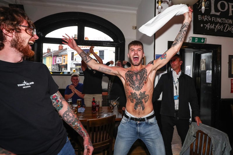 Fans pictured in The Kings pub celebrating as England score their first goal. Picture: Stuart Martin (220421-7042)