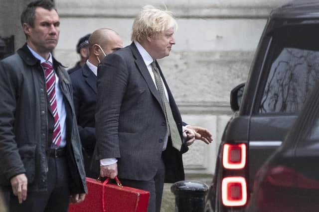 Prime Minister Boris Johnson leaving Downing Street in London on Friday (December 17)