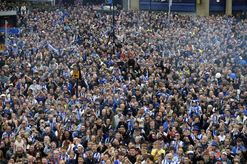 Thousands of fans turned out for the promotion parade to walk alongside the open topped bus.