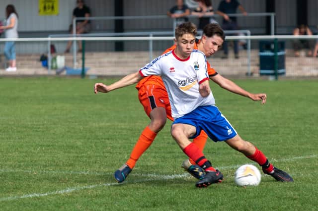 Dylan Holgate (white top) bagged a hat-trick in Gosport Borough under-18s' win at Portchester. Picture: Mike Cooter (050921)