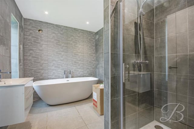 Another example of the quality that radiates through the property. En suite facilities that again include a free-standing bath and walk-in shower.