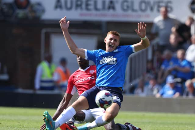 Posh midfielder Hector Kyprianou is fouled during the game against Morecambe. Photo: Paul Marriott/theposh.com.