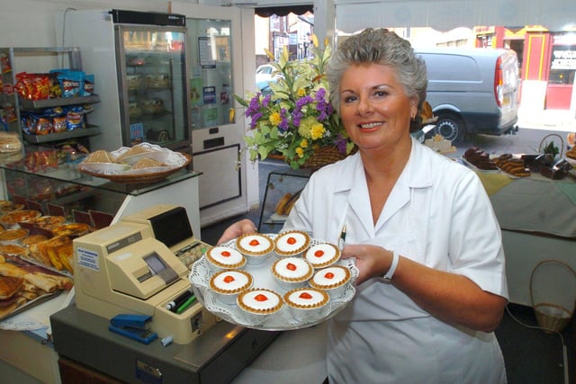Pictured at Perfectionery the cake bread and bun shop on Sharrow Vale Road, Sheffield, which  has been trading for 20 years in 2006. Seen is  Lynda Barber in the shop with cherry bakewells.
