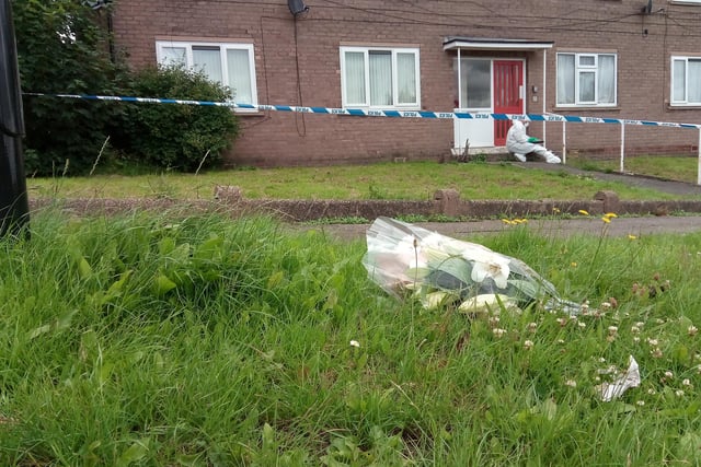 Flowers at the scene on Ravenscroft Place, Sheffield
