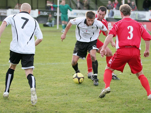 Ian Holmes on the ball for Eastwood.