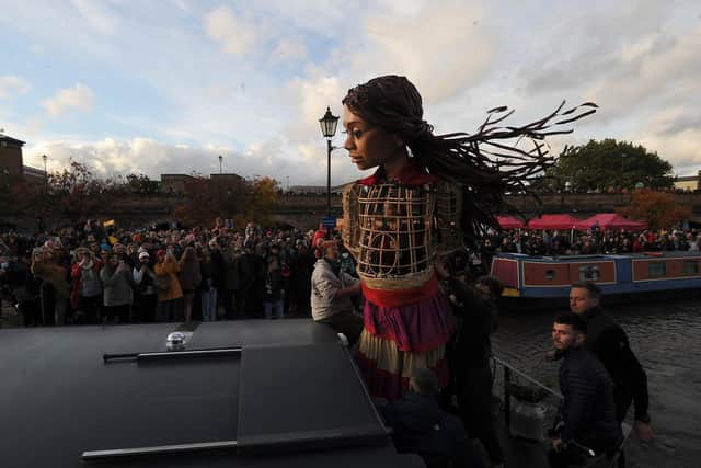Little Amal meets the the public at Victoria Quays, Sheffield..29th October 2021..
