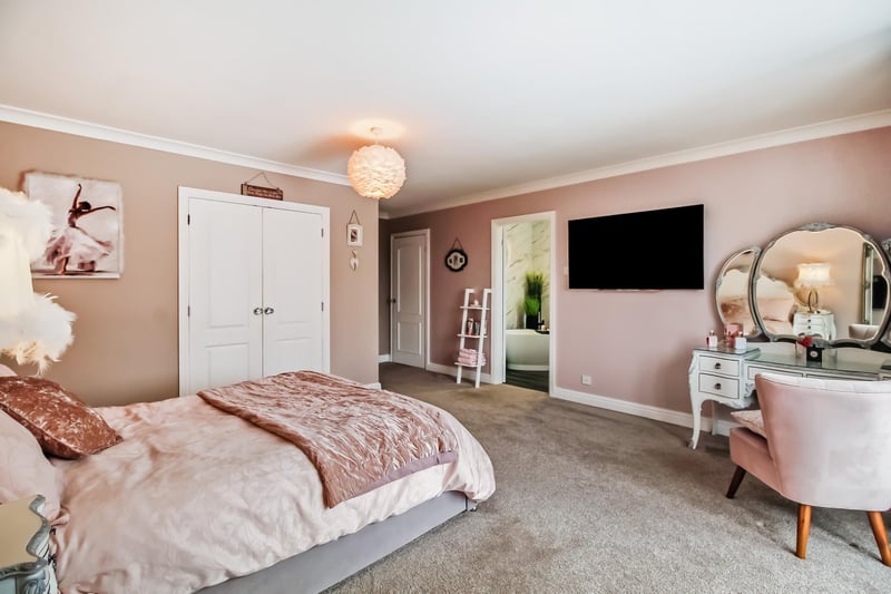 The master bedroom has a useful walk-in wardrobe and a stunning three-piece ensuite bathroom.