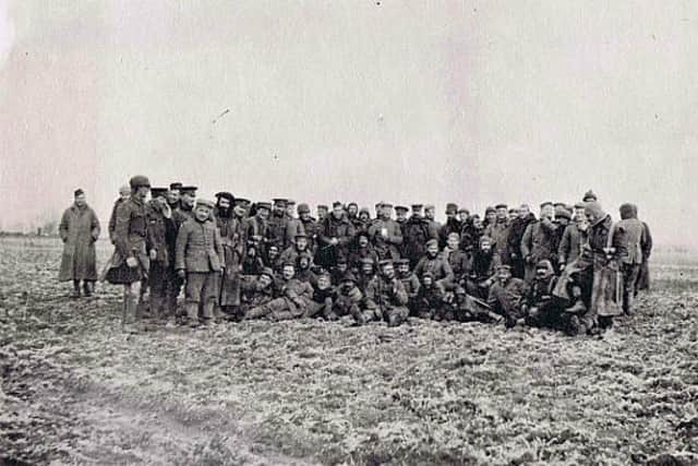 Gordon Highlanders posing for the camera with German soldiers in No Man’s Land on Christmas Day 1914