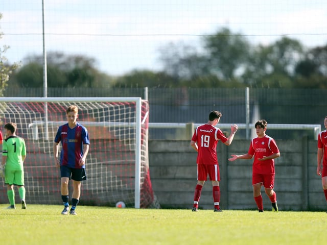 Martin Buckland is congratulated after scoring for Horndean against US Portsmouth. Picture: Chris Moorhouse