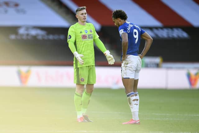 Sheffield United's goalkeeper Dean Henderson, left, talks with Everton's Dominic Calvert-Lewin after Premier League match between Sheffield United and Everton at Bramall Lane in Sheffield, England, Monday, July 20, 2020. (AP Photo/Peter Powell, Pool)