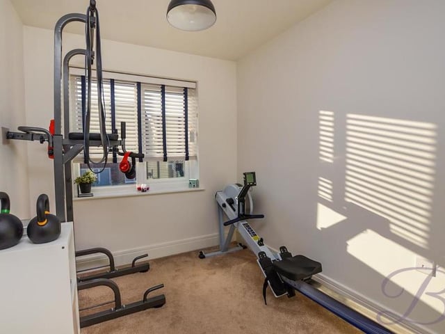 Like the other two bedrooms, the third also comes with a carpeted floor and double-glazed window. As you can see, it is a versatile space that could even be turned into a mini-gym to keep you fit.