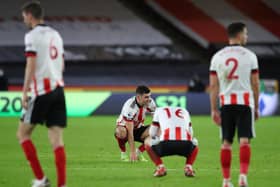 John Egan looks dejected following Sheffield United's defeat by Everton: Simon Bellis/Sportimage