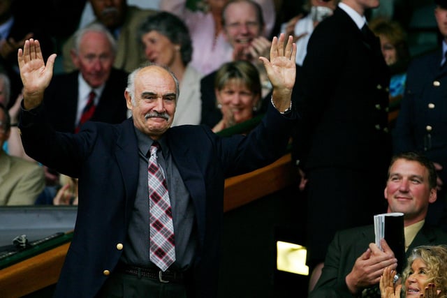 Scottish actor Sean Connery waves to the gallery from the Royal Box on Centre Court at the 119th Wimbledon Tennis Championships in London, 25 June, 2005.