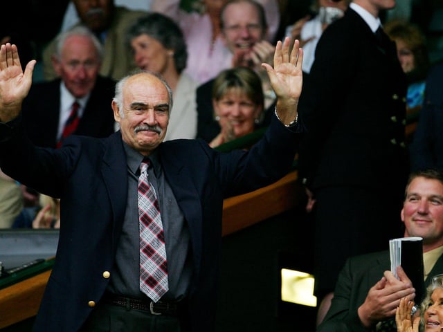 Scottish actor Sean Connery waves to the gallery from the Royal Box on Centre Court at the 119th Wimbledon Tennis Championships in London, 25 June, 2005.