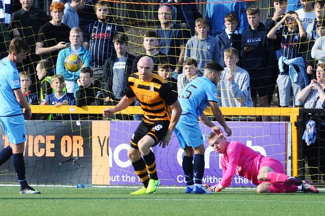 Falkirk fans at Alloa's Indodrill Stadium look on in dismay Conor Sammon scores against his old club