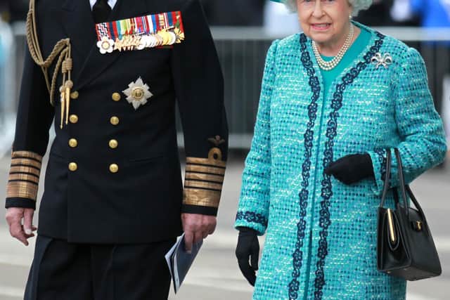 File photo dated 04/07/14 of Queen Elizabeth II and the Duke of Edinburgh at the formal naming ceremony for HMS Queen Elizabeth in Rosyth Dockyard, Fife. Picture: Andrew Milligan/PA Wire