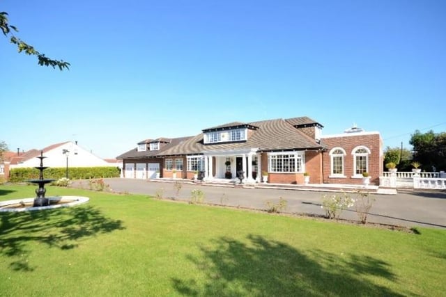 The house is situated on a large plot of land on Stockton Road, with gated access.