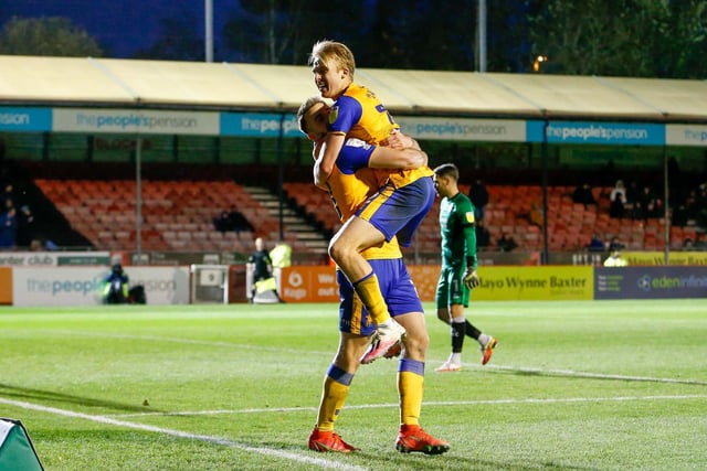 Rhys Oates celebrates his winning goal with team mate George Lapslie.