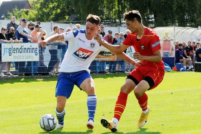 Sheffield Wednesday youngster Ryan Galvin (right) battles for the ball on loan at Gloucester City.
