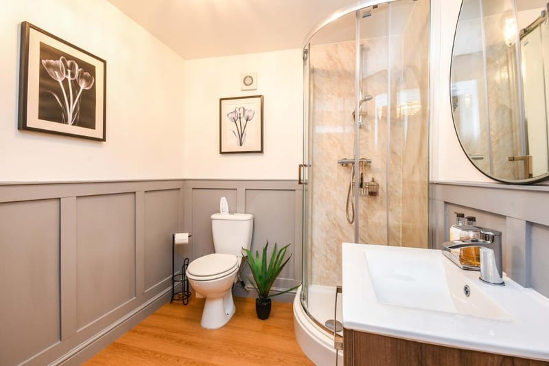 The ensuite accessed via the main bedroom/garden room has a heated towel rail, LVT flooring, part tiled walls and extractor fan. There is a single shower enclosure, WC and vanity sink with a mixer tap.