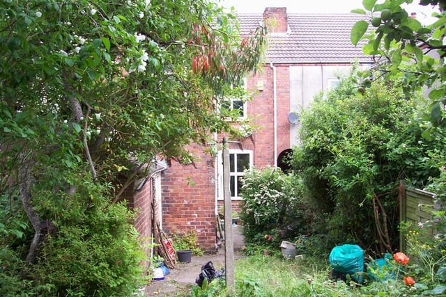 To the rear of the property there is an enclosed established garden with outhouses that include a wc and coal house.