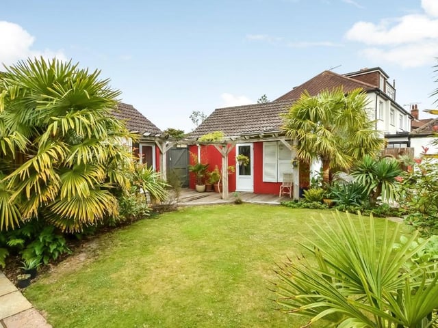 The house has a Tropical-style garden