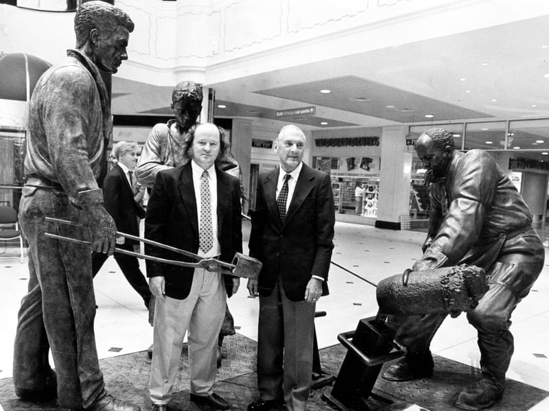 Sheffield teemer George Dalton, left, and sculptor, Robin Bell, with the bronze figures depicting the traditional teeming that were unveiled by Mr Dalton at Meadowhall Shopping Centre, September 7, 1990