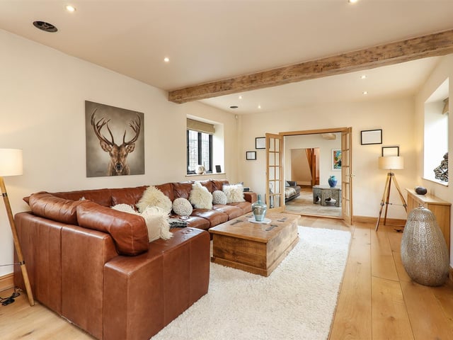 This "huge" open plan room leads to the reception room.