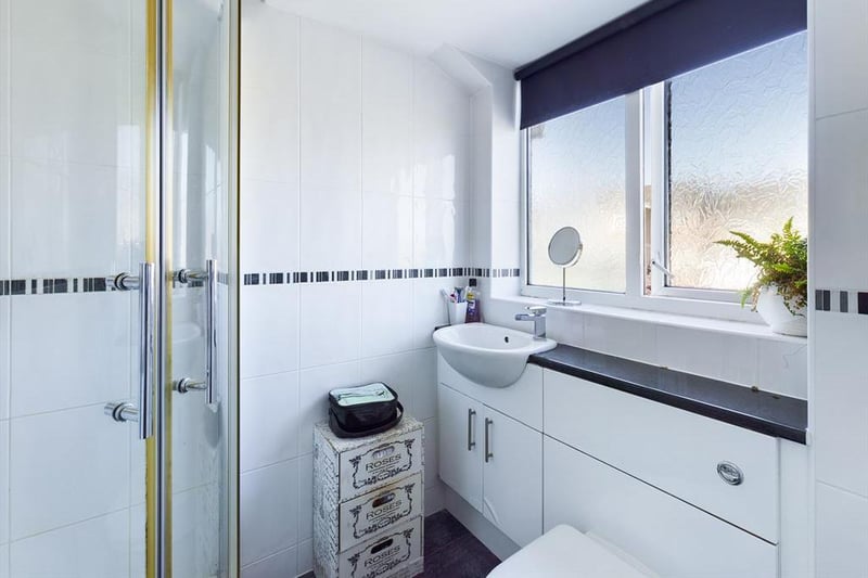 The main bedroom boasts a modern ensuite shower room.
