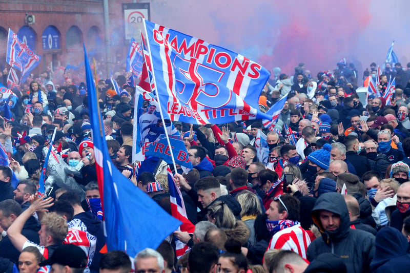 Rangers fans celebrate outside of the Ibrox Stadium after Rangers win the Scottish Premiership title.