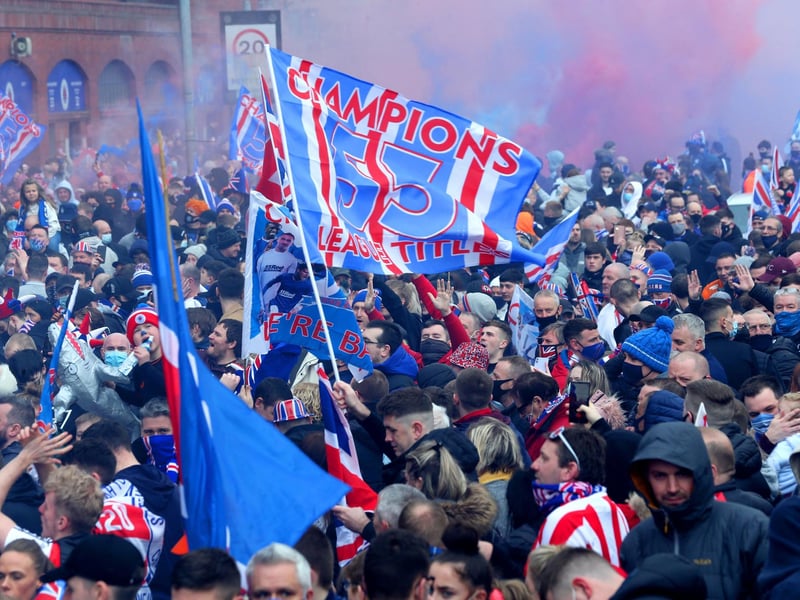 Rangers fans celebrate outside of the Ibrox Stadium after Rangers win the Scottish Premiership title.