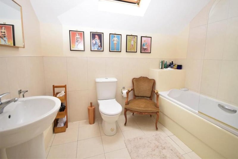 The bedroom suite, or annexe, has its own en suite, with panelled bath and shower over. It also has a low-flush WC, wash basin and heated towel-rail.