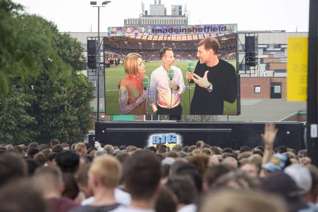 Football fans watch the World Cup Semi-Final between England and Croatia on Devonshire Green in 2018.
