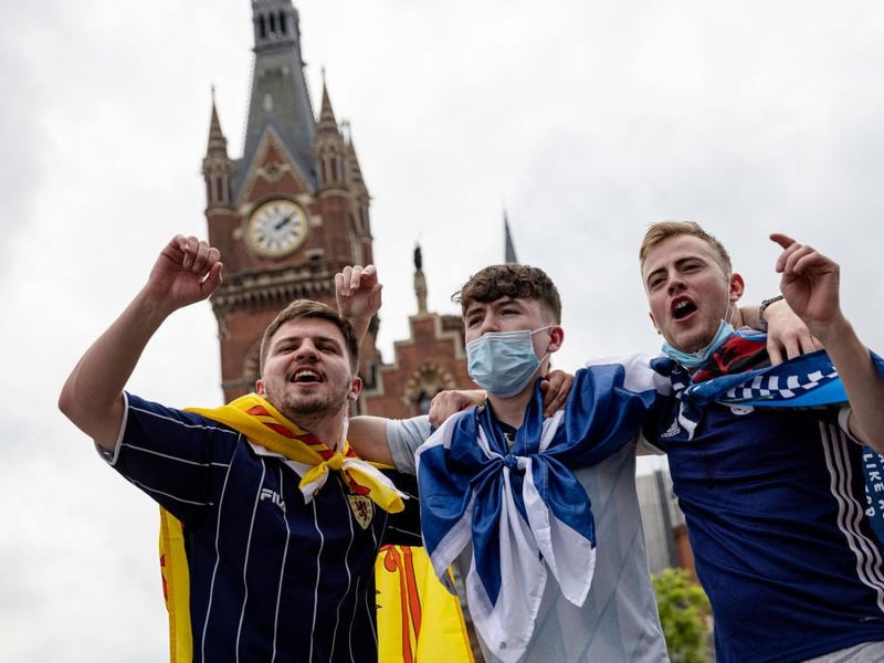 These Covid-conscious chanters were ready to boogie all day long as they showed off their flags outside King's Cross station in London, hours before the match at Wembley.