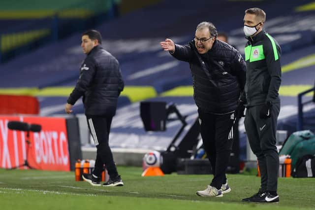 Marcelo Bielsa, manager of Leeds United, gives his team instructions during the Premier League match between Leeds United and Aston Villa at Elland Road on February 27, 2021.
