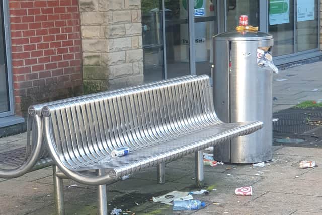 Litter covers a bench in Spital Hill.