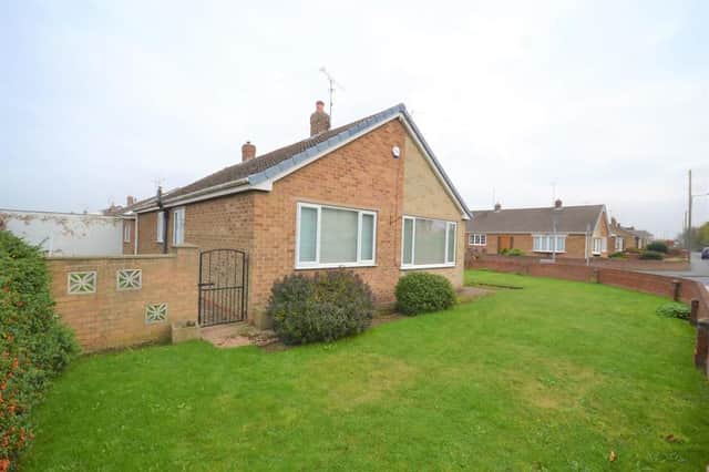 This superb detached bungalow takes a wonderful corner plot with brick built boundary walls, a single iron gate opens to a garden path leading to the main entrance door and double iron gates open to a concrete drive providing off road parking and access to a detached garage.