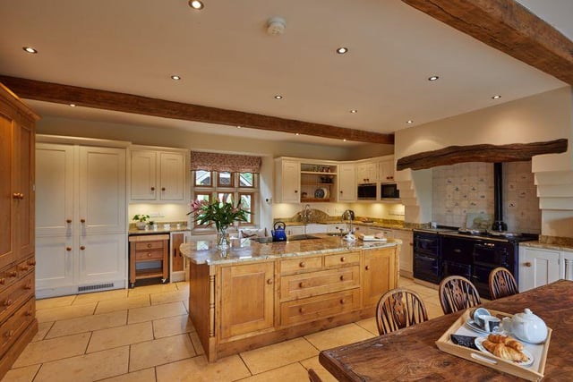 The spacious breakfast kitchen is in keeping with the original architecture and boasts granite work surfaces, a feature island, an aga cooker and access to the rear garden.