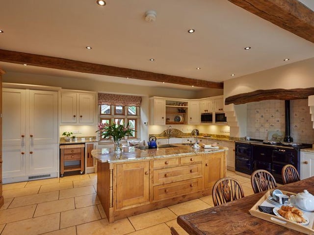 The spacious breakfast kitchen is in keeping with the original architecture and boasts granite work surfaces, a feature island, an aga cooker and access to the rear garden.