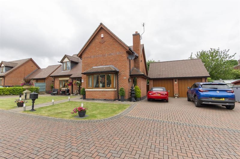 The property boasts a detached, brick-built, double garage with two electric 'up-and-over' doors, light, power and loft storage.