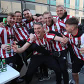 Toddla T, celebrating promotion with Blades players, said: “Well done KES and all involved."