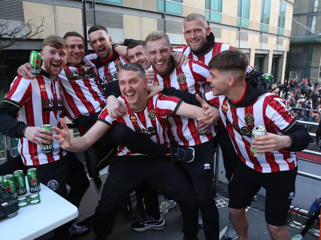 Toddla T, celebrating promotion with Blades players, said: “Well done KES and all involved."