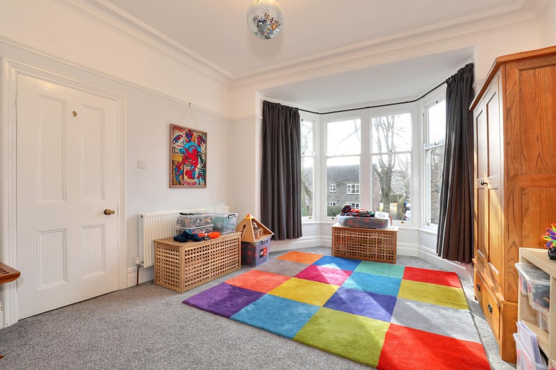 This good sized room has a lovely bay window which looks out on the tree-lined road.