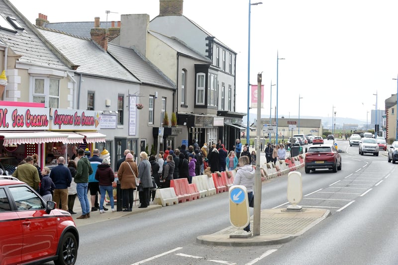 Families wait in a Good Friday fish and chip queue at The Almighty Cod, in Seaton Carew.