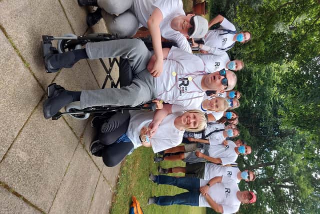 Family and friends complete 24-mile round trek for superfan Rich who suffered brain stem bleed and stroke last year.